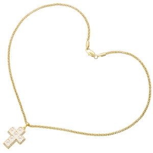 Detailed close-up of golden cross pendant with square cubic zirconia on a heart-shaped chain
