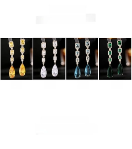Detailed view of long water-drop zircon earrings available in yellow, white, blue and green