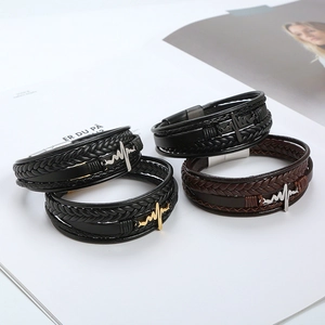 Close-up of four multi-layer leather bracelets with ECG pattern and magnetic metal clasps
