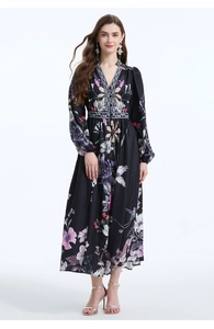 Detail of V-neck floral maxi dress with lantern sleeves and ruffled waist on black base