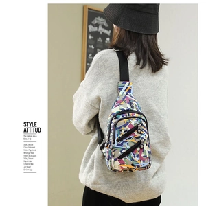 Nylon crossbody chest bag for women with colorful abstract print and multi-zipper pockets