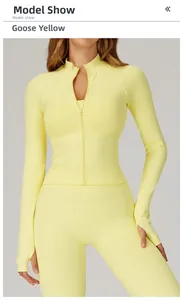 Detail of goose yellow seamless zip yoga jacket with thumbhole sleeves and slim fit