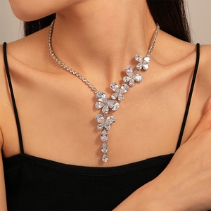 Elegant silver butterfly flower necklace with sparkling zircons on model's neck