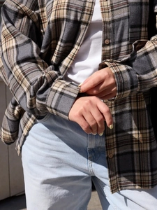 Vintage oversized plaid flannel shirt in neutral tones for casual street style women wear