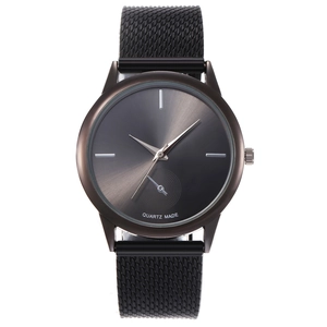 Detailed view of black quartz watch with mesh strap and grey sunray brushed dial