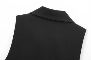 Close-up of stand-up collar and stitching details on high-density woven black vest
