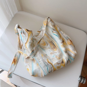 Canvas tote bag with colorful marble wood grain print and knotted shoulder strap detail