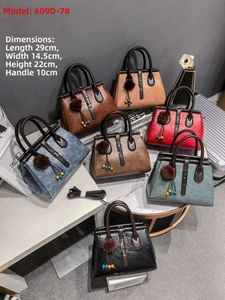 Collection of leather handbags in seven colors with decorative charms and metal accents