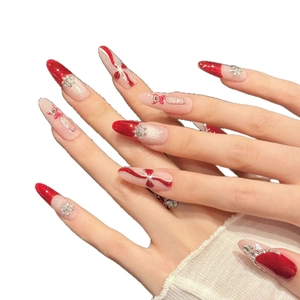 Red glitter press-on nails with 3D bows and champagne glass hand-painted designs