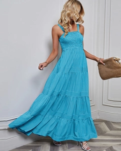 Detail of light blue pleated camisole dress with vertical stripe texture and ruffles