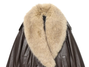 Detail of dark brown faux leather jacket featuring a detachable light brown faux fur collar