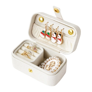 Portable pearl white travel jewelry box in lychee leather with ring slots and hooks