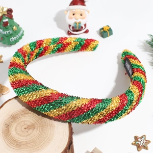 Detailed view of padded Christmas headband with festive glittery candy cane stripes