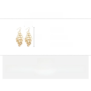 Detailed view showing layered golden metal sequins on stylish iron drop earrings