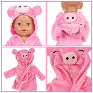 Detailed view of pink pig doll bathrobe showing sewing quality and fabric texture