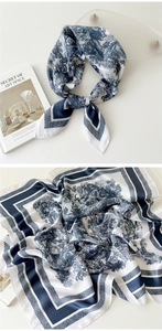 Detail of navy blue and white Toile de Jouy silk scarf with jungle pattern print