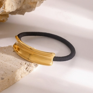 Minimalist black elastic hair tie with polished gold rectangular stainless steel accent