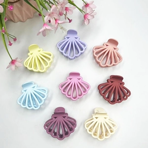 Set of 8 matte shell-shaped hair claw clips in assorted pastel and vibrant colors