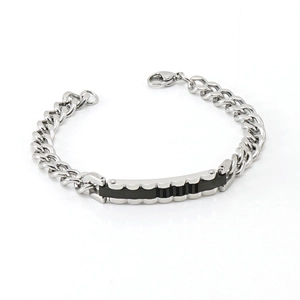Detail view of 8mm men's stainless steel curb chain with a black plate accent