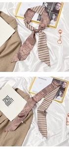 Detail of elegant French style pink and brown silk twilly scarf with vintage patterns