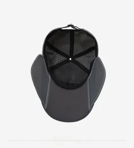 Detail view of the breathable mesh lining and laser-cut holes on this dark grey sun hat