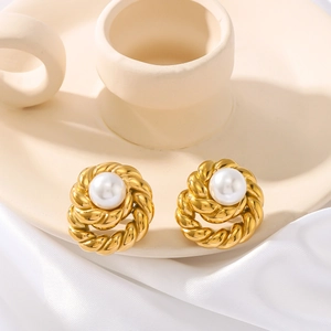 Vintage gold twist rope earrings with white pearls on elegant silk and ceramic background