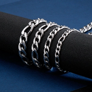 Macro detail of silver stainless steel NK link chains in four different thicknesses