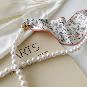 French vintage pearl necklace with abstract face print silk scarf tie for women