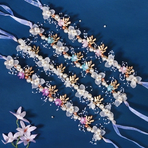 Handmade golden leaf bridal headband with white fabric flowers and crystal beads