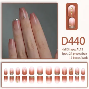 Gradient cherry pink press-on nails with gold metal lines and rivet details, 24-piece set