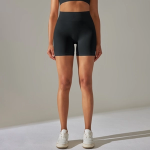 Macro detail of high-waist seamless black sports shorts featuring elastic texture
