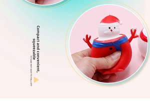 Close-up of squeezing a red Santa Claus squishy toy to show its soft elastic texture