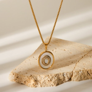 18K gold plated stainless steel necklace featuring a shell oval pendant with crystal O