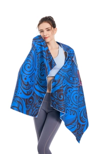 Detail of blue mandala microfiber beach towel with fine white stitched edge finishing