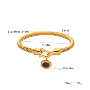 Gold-plated stainless steel twisted bangle with black Roman numeral charm pendant
