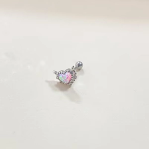Detail of silver heart belly ring with pink and blue opal in arrow design