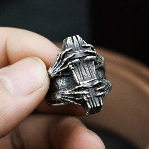 Retro gothic coffin ring with skull hand relief in a vintage silver finish for men