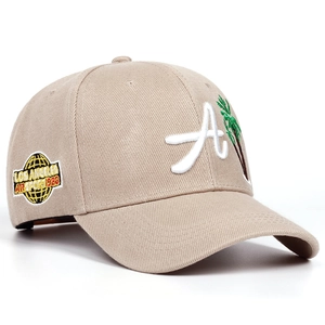 Detail of khaki baseball cap featuring white A embroidery and green palm tree logo