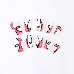 Press-on nails set with pink wave patterns and black curved lines on white base