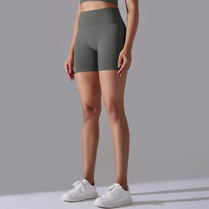 Detail of high-waisted seamless ribbed yoga shorts in dark olive green for fitness