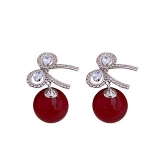 Silver bow earrings with red pearl and sparkling zircon stones in a retro French style