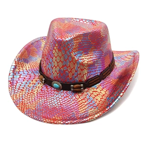Macro shot of colorful snakeskin pattern on pink cowboy hat with turquoise bead detail