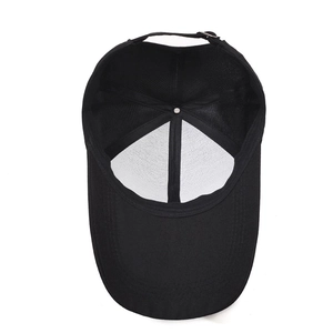 Internal view of a black baseball cap with extended brim and adjustable back strap