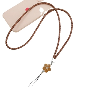 Brown braided PU leather phone lanyard strap with clover pendant on pink case