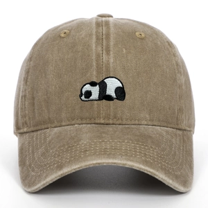 Close-up of vintage washed khaki baseball cap featuring panda embroidery detail