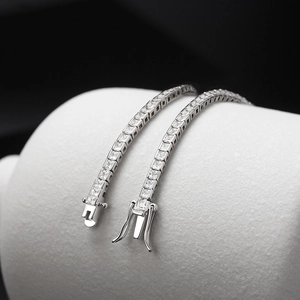 Detailed close-up of square-cut cubic zirconia tennis bracelet with secure double clasp