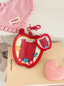 Detail of red apple acrylic card holder with matching mini charm and star stickers