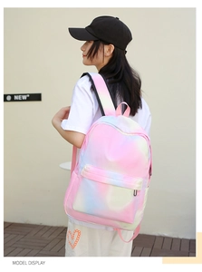 Rear view of model wearing pink gradient casual backpack with adjustable straps