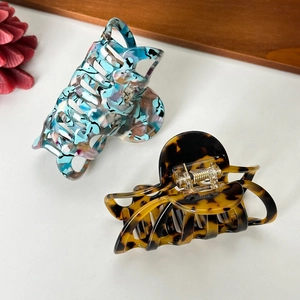Acetate hair claw clips in blue marble and classic brown tortoiseshell patterns