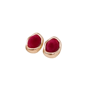 Retro golden round earrings with red flocking texture and organic irregular design